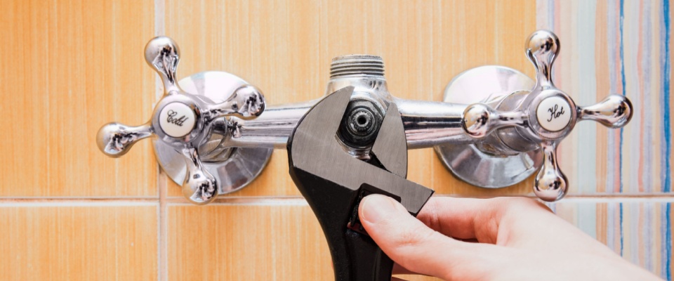 fixing leaky faucets in an energy efficient apartment.
