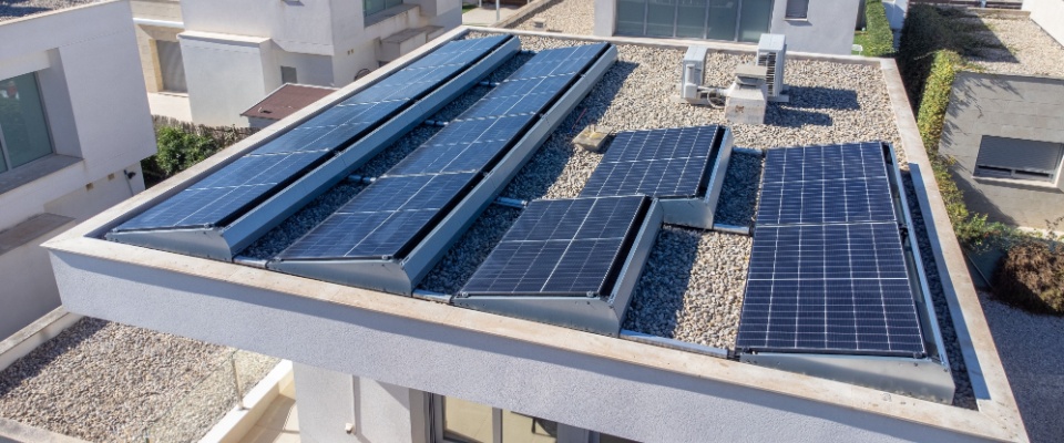 A family couple turns on the wall-mounted air conditioner at home, controlling the indoor climate and ensuring living space comfort—an important feature often considered when looking for apartments in Sacramento.