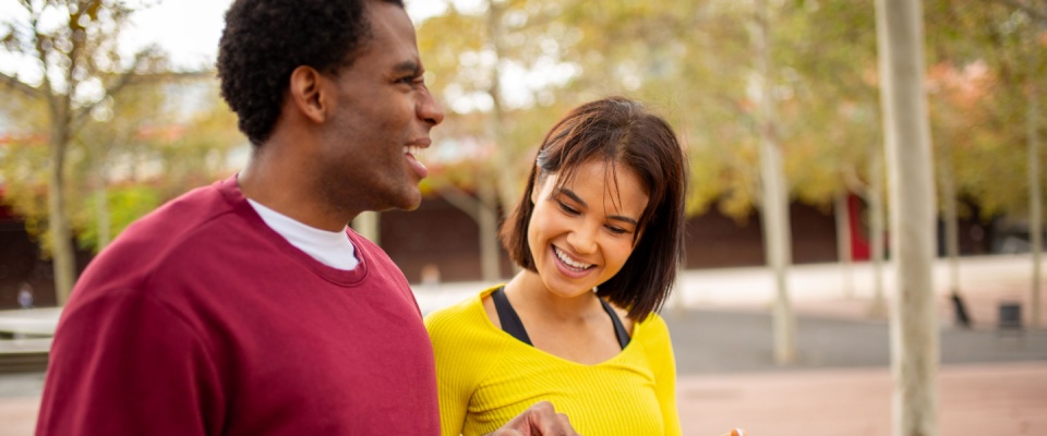 Friends walking and chatting about options for a great deal on a rental.