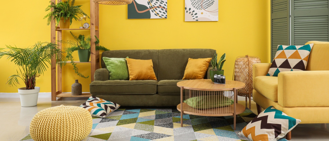 Elegant living room interior featuring a modern electric fan placed on a stylish shelving unit. The space combines comfort and functionality, highlighting new features in home climate control and smart decor elements for a contemporary lifestyle.