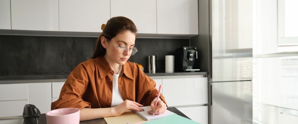 A person making a budget before renting an apartment.