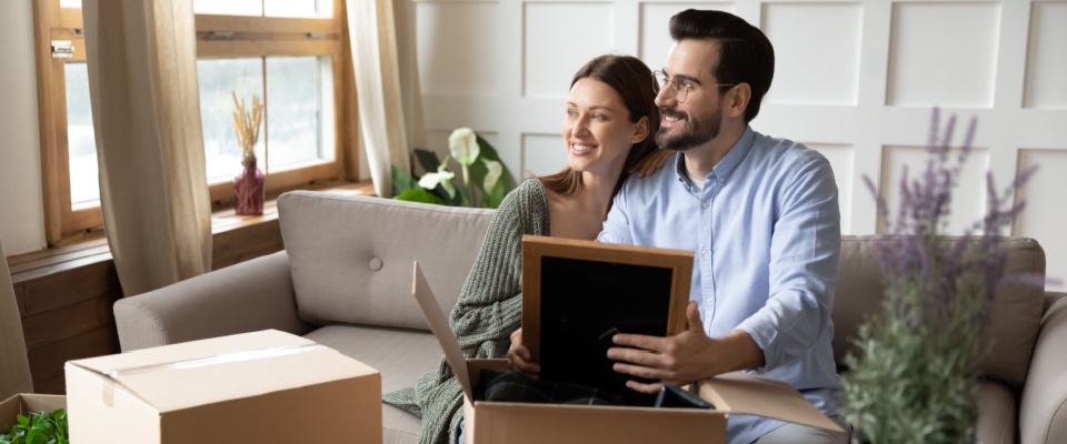 A couple deciding how to decorate after renting an apartment.