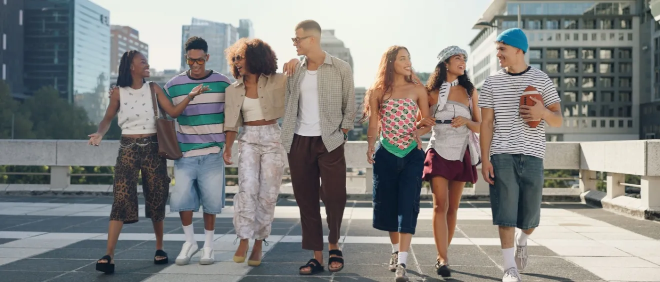A group of Gen Z renters walking in the city with buildings in the background.