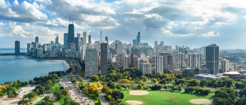 A panoramic view of downtown Chicago with its iconic skyline along Lake Michigan, seen under partly cloudy skies. Chicago ranks as the second hottest U.S. rental market during the peak rental season of 2025.