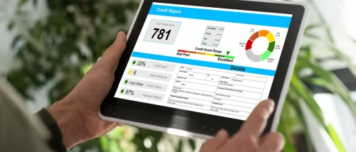 person holds a digital tablet displaying a detailed credit report with a high credit score, pie chart, and payment history, highlighting how rent reporting can positively impact a renter’s financial profile.