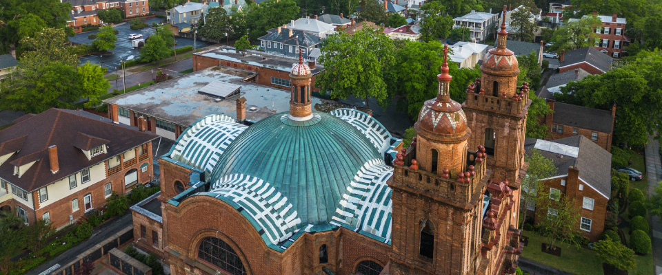 An aerial shot of the Basilica of St. Mary in Wilmington, NC, a city where the cost of living is lower than both the state and national averages.