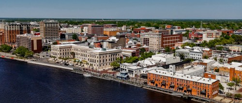 A waterfront shot of Wilmington, NC, a city where the cost of living is lower than both state and national averages.