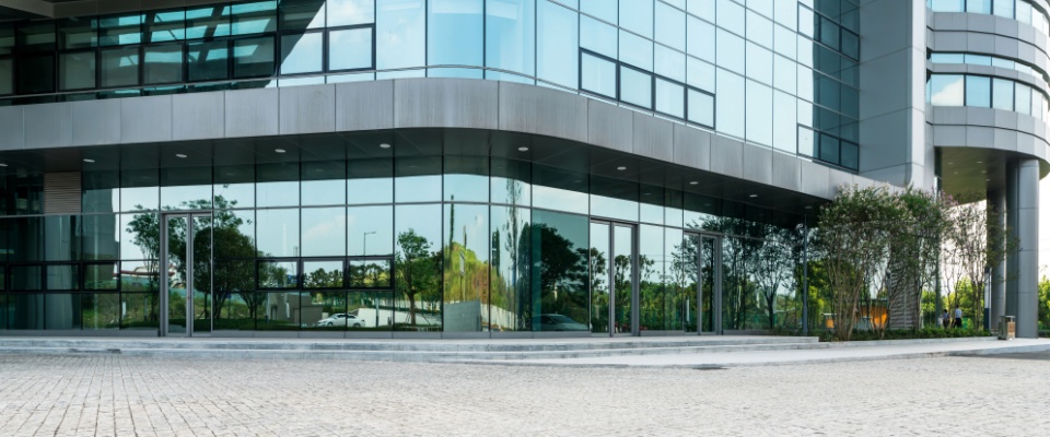 An empty urban plaza in front of a modern hospital building in downtown, showcasing clean infrastructure and accessible healthcare—key factors for individuals considering apartments in Cincinnati.