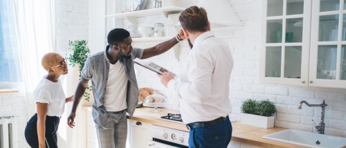 A couple attends a landlord’s move-out inspection of their rental apartment.