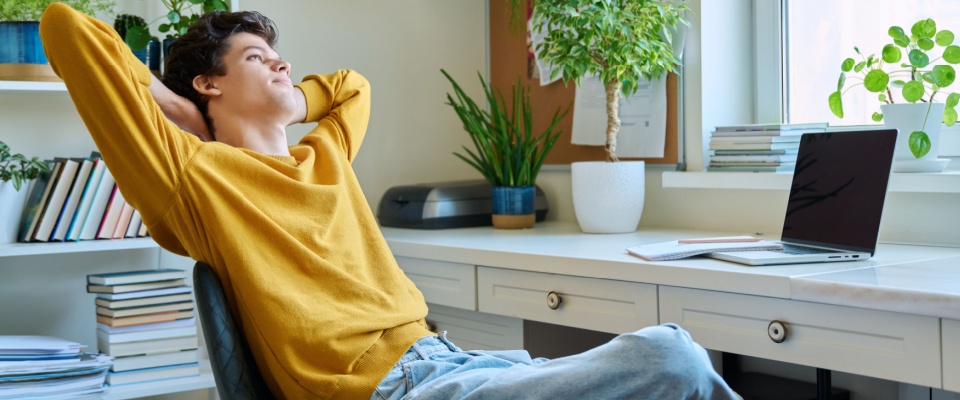 A person embracing life in their first college apartment.