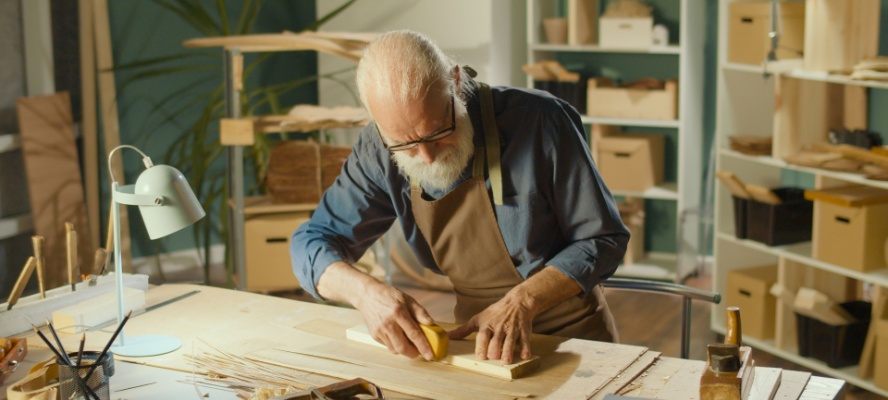 Old man woodworking.