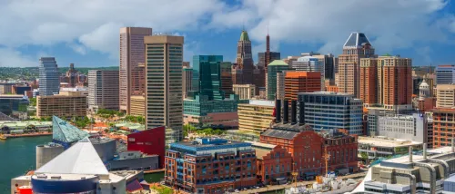 Baltimore's Inner Harbor skyline in the afternoon offers a scenic view of the city, making it an appealing spot for those exploring apartments in Baltimore with waterfront access and urban living.