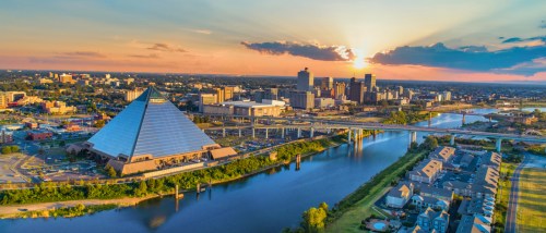 An aerial shot of the Mississippi River and the skyline in Memphis, TN, a city where the cost of living is below the state and national averages.
