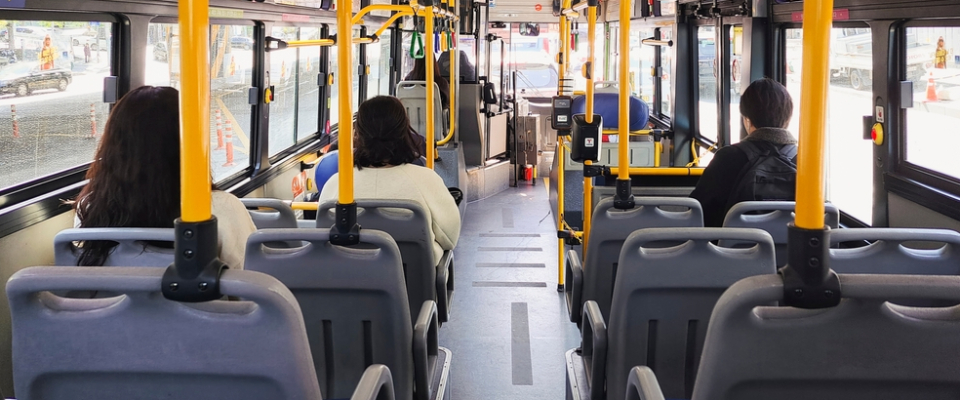 Interior of a DDOT bus in Detroit with passengers seated, highlighting the city’s main public transit option that renters rely on for daily commutes and convenient travel across neighborhoods.