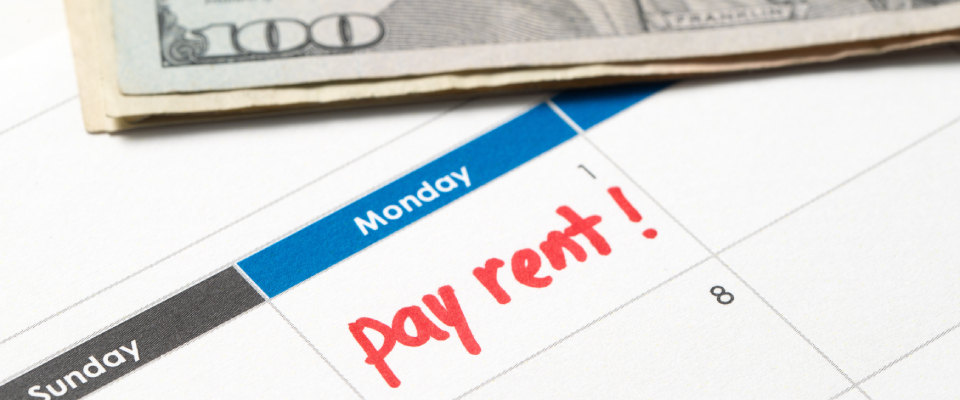 A calendar with the text "Pay rent!" written in red marker, reminding the renter to avoid the rent grace period.