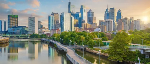 A view of Philadelphia's skyline with skyscrapers and the Delaware River to illustrate the cost of living in Philadelphia.