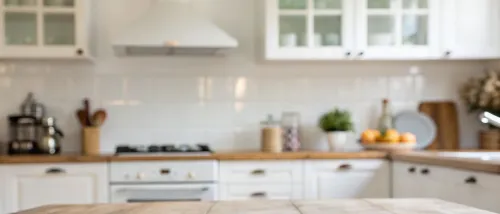 Bright modern kitchen interior with clean countertops, cooking utensils, and appliances, illustrating the importance of organization and safety in the kitchen.