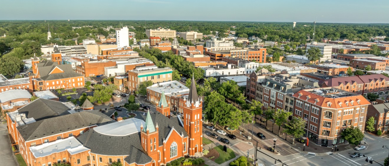 An aerial shot of Fayetteville, NC, a city where the cost of living is below both the state and national averages.