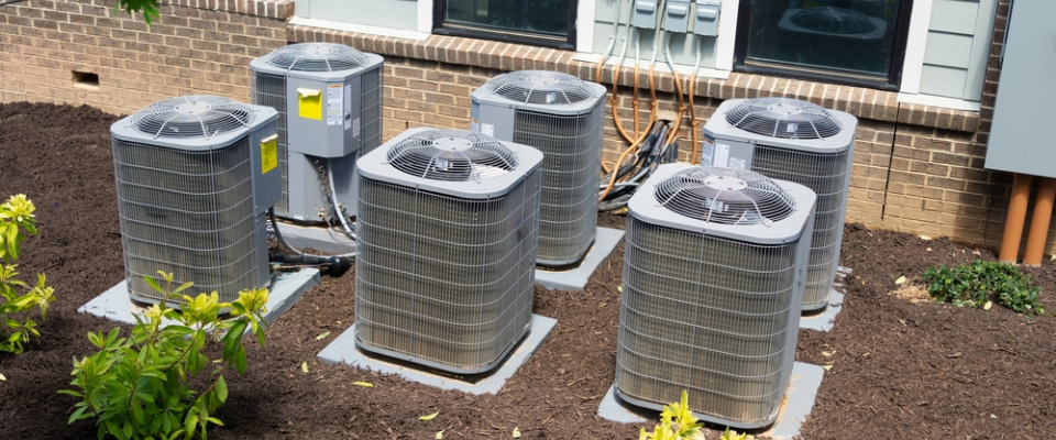 HVAC units outside an apartment building in Huntsville, Alabama — illustrating key maintenance questions renters should ask before leasing apartments in Huntsville.