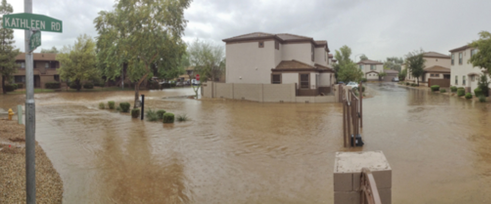 Flooded apartment community in Phoenix, Arizona, during a monsoon storm, showing the importance of flood preparedness and safety when renting in Phoenix.
