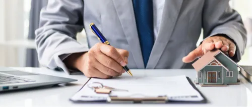 Real estate brokers showing homes to prospective buyers while discussing property insurance, illustrating options for renting or buying without requiring a landlord reference.