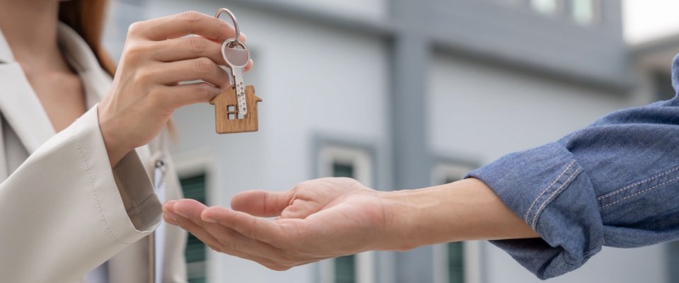 A person signed a lease after learning the renting basics.