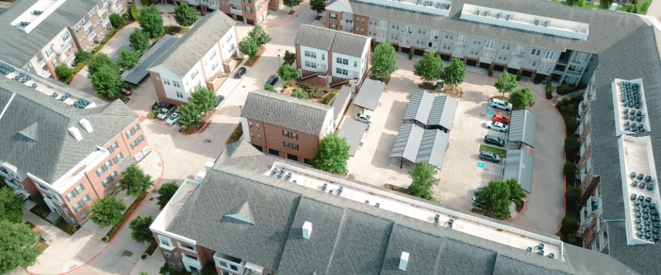 Aerial view of a modern apartment community, representing housing options and practical downsizing tips for seniors moving to smaller spaces.