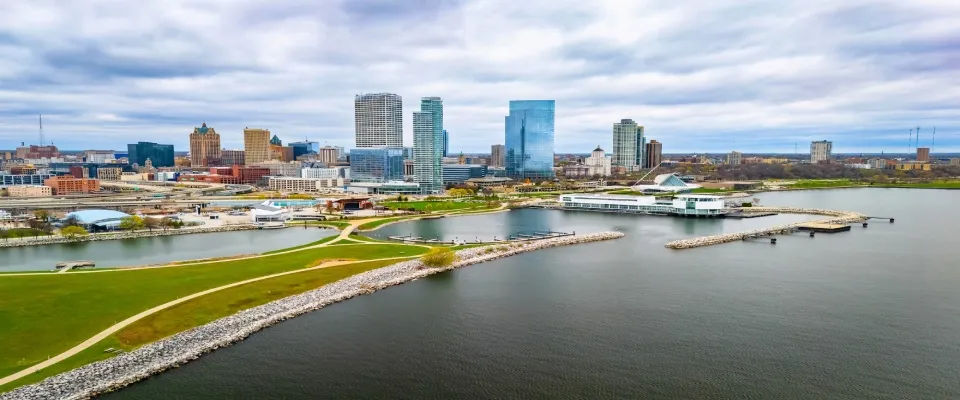 Milwaukee, Wisconsin skyline with modern skyscrapers along Lake Michigan, representing urban housing trends and insights for a renter engagement tracker.