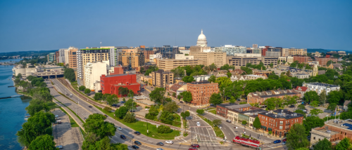 An aerial shot of downtown Madison, WI, a city where you can find neighborhoods where the rent costs below the city average.