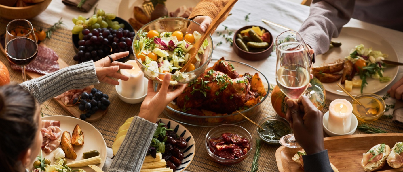 Group of people celebrating Thanksgiving together, showcasing how apartment etiquette is helping bring people together.