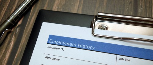 A clipboard containing a blank employment history form.