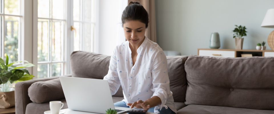 A person doing their finances after transitioning to living alone.