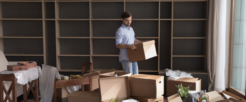 Person moving boxes to start living alone.