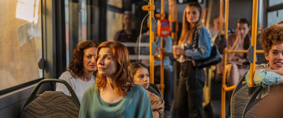 People using public transit in the city.