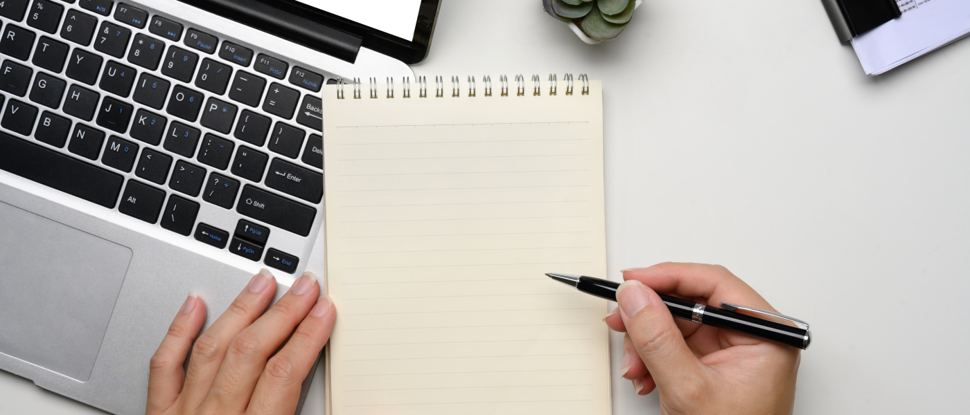 A person taking down notes on who to ask for rental references.