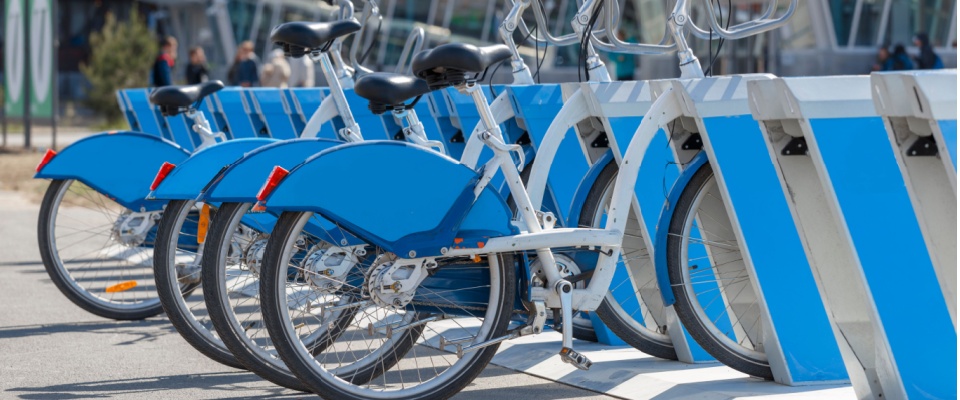 Blue city bikes for rent, bike sharing services to illustrate public transport in Denver.