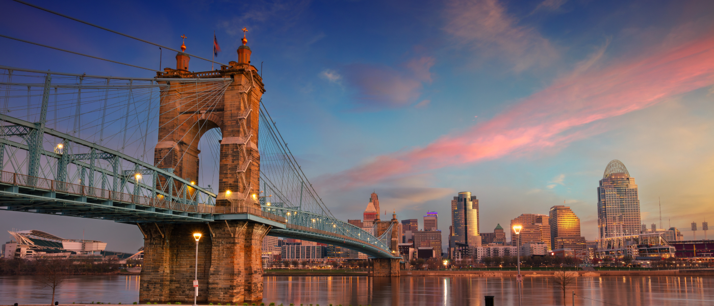 A waterfront view of Cincinnati, a city where the average cost of living is slightly higher than the state average but lower than the national average.