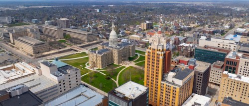 An aerial view of Lansing, MI, a city where the cost of living is below state and national averages.