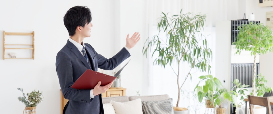 Apartment hunt concept showing a businessman giving a guided tour of a residential property, highlighting the process of viewing and evaluating potential apartments.
