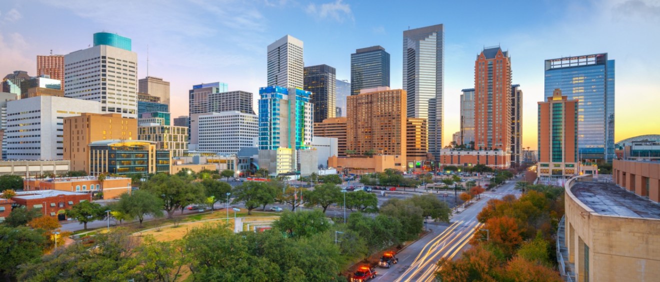 Morning view of downtown Houston skyline and park, highlighting the appeal of new apartments in Houston.