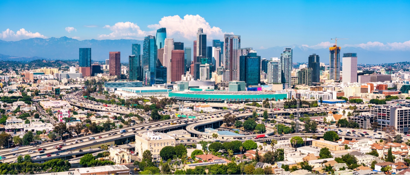 Aerial drone view of Los Angeles, showcasing the city skyline and surrounding neighborhoods, ideal for highlighting new apartments in Los Angeles.
