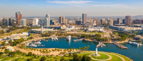 Aerial view of Long Beach, California showing the downtown skyline, marina, waterfront park, and lighthouse. Explore the five key question to ask before renting an apartment in Long Beach.