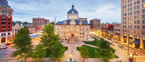 Affordable neighborhoods in Lexington, KY, showing the historic downtown at blue hour with softly lit buildings and a calm city atmosphere.
