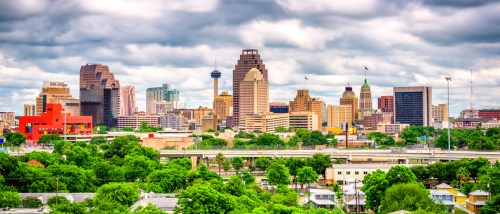 San Antonio, TX skyline with downtown high-rises, highways, and surrounding neighborhoods—highlighting the urban layout renters should consider when asking key questions before renting an apartment in San Antonio.