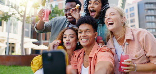 happy college students taking pictures