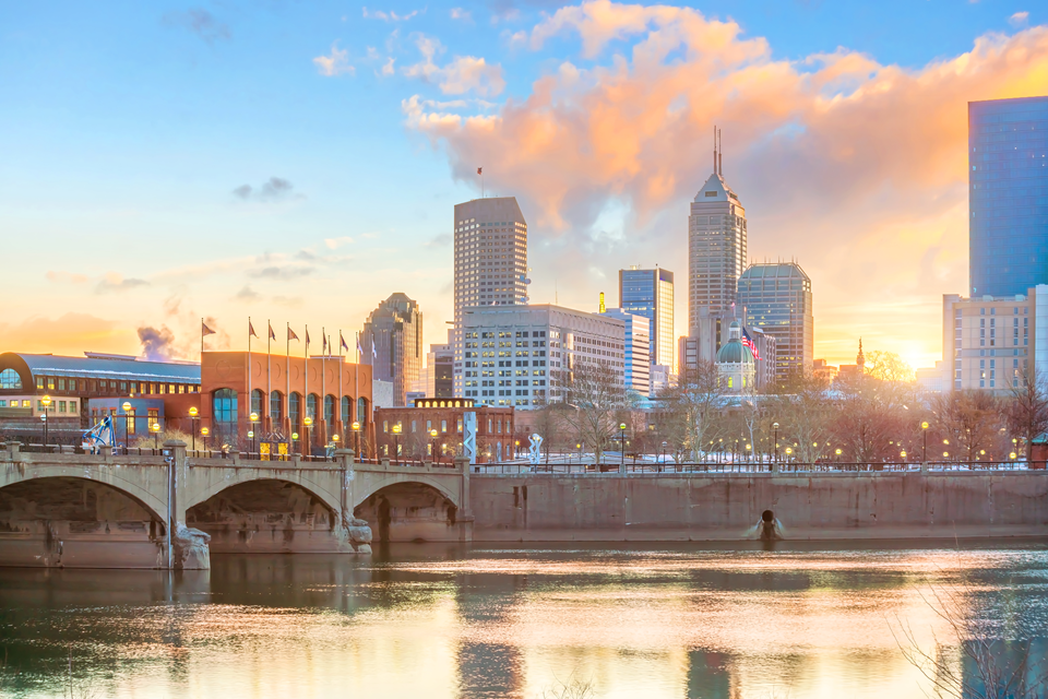 view of indianapolis from the canal with bridge and downtown skyline view