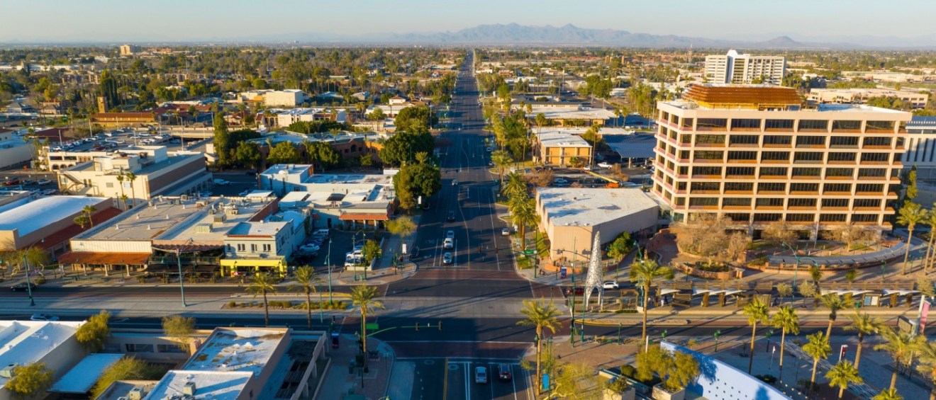 New apartments in Mesa highlighted by an aerial sunset view of the city center at Main Street and Center Street in Mesa, Arizona.