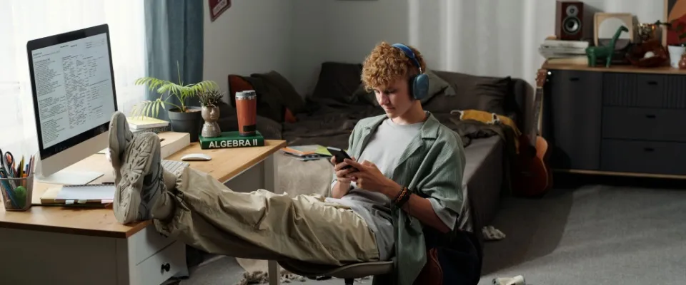 A student in their bedroom in off-campus housing.
