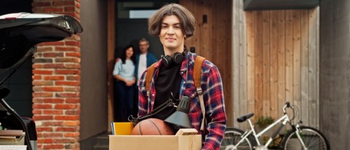 A college student in the process of moving into off-campus housing.