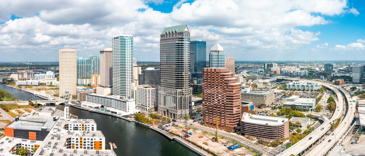 Downtown Tampa skyline along the Hillsborough River, showing dense urban development near transit routes, highlighting Tampa public transport access for renters in central neighborhoods.